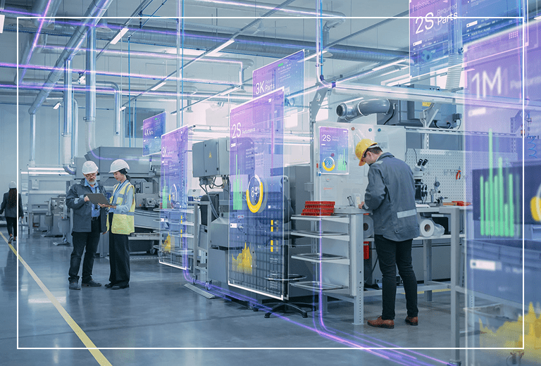 Futuristic factory with workers and digital screens.