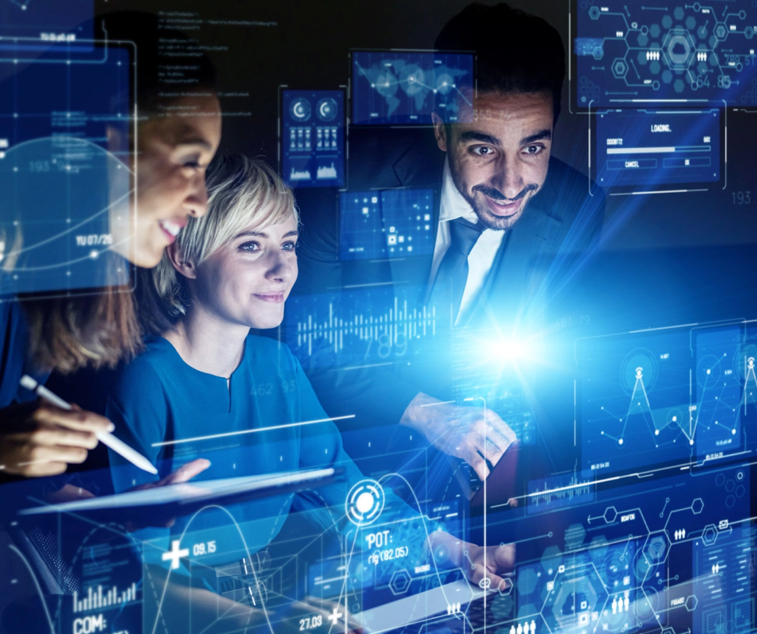 People analyzing futuristic digital data displays.