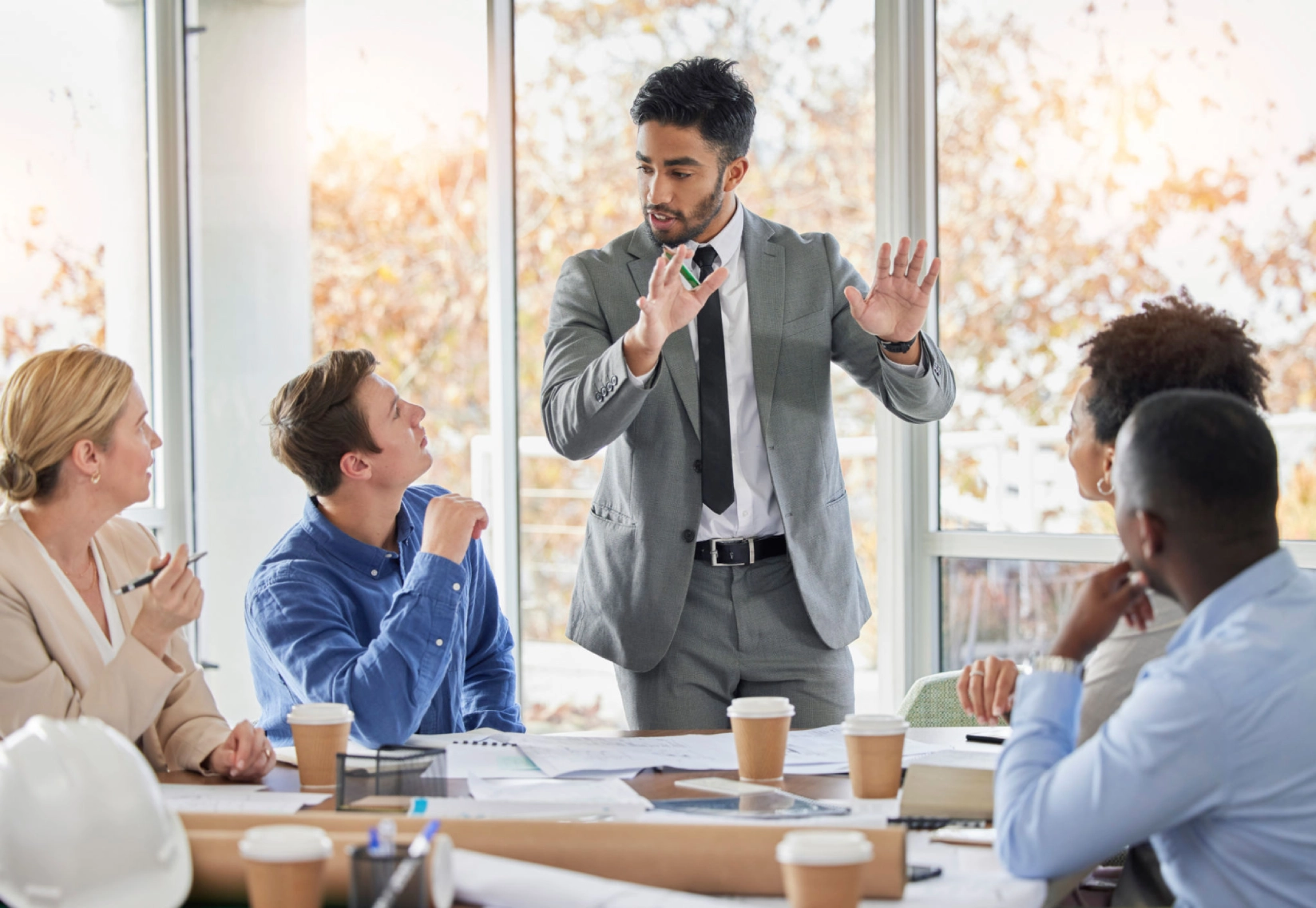 Business meeting with diverse team discussing ideas.